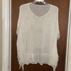 Crocheted poncho with fringe​